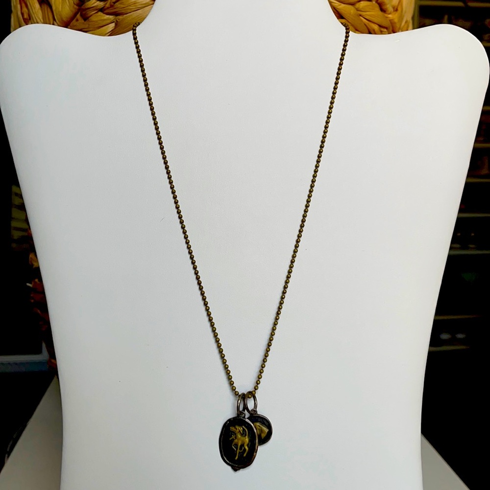 Waxing poetic dog charms on beaded necklace